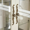 Illuminated Glass Curio Display Cabinet with Adjustable Shelves, Double Doors, and Drawer - Glass Wine Storage Solution