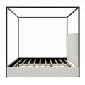 Contemporary Luxe Metal Canopy Bed Featuring a High Upholstered Headboard
