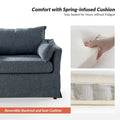 Sophie Contemporary Oversized Slipcovered Armchair and Ottoman with Lockable Rear Wheels