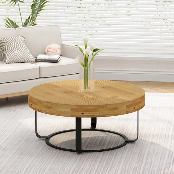 Contemporary Round Wooden Coffee Table with Intricate Carving and Metal Legs